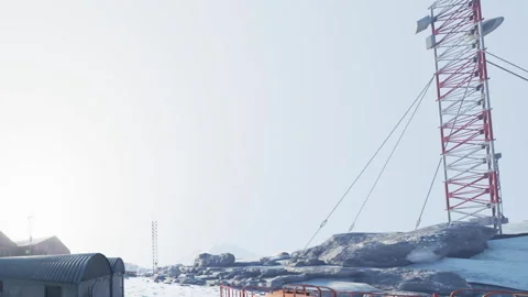 Communication Tower Stands Tall Against the Snowy Backdrop of a Remote Location Stock Footage 344819098