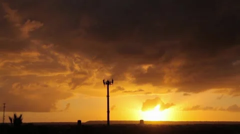 Communication tower with a sunset in background Stock Footage 51082297