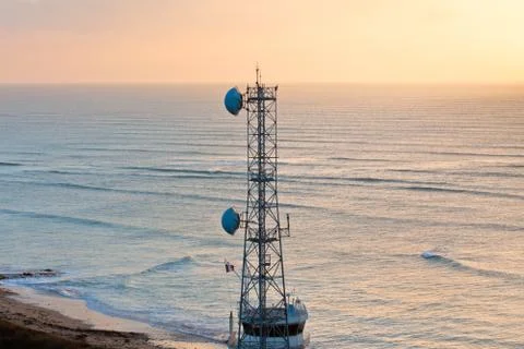Communication tower at sunset Foto stock