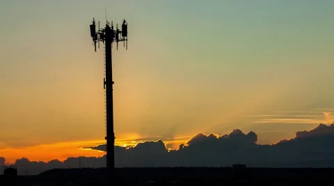 Communication tower with a sunset timelapse in background Stock Footage 49326300