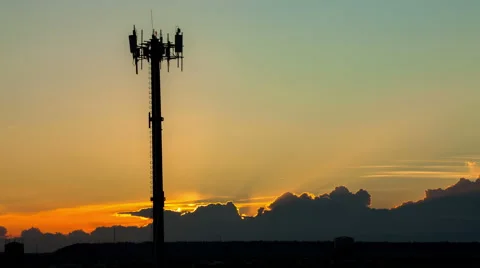 Communication tower with a sunset timelapse in background Stock Footage 50607333