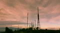 communication towers antennas site wide view mountain dusk timelapse HD Footage