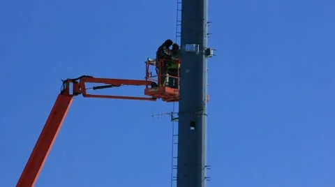 Communication workmen installing rf antennas Stock Footage 10805373