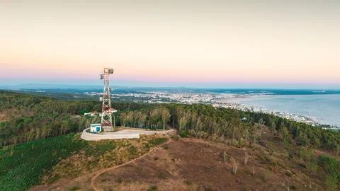 Communications Tower Above Wind-Damaged Coastal Woodland Stock Photos