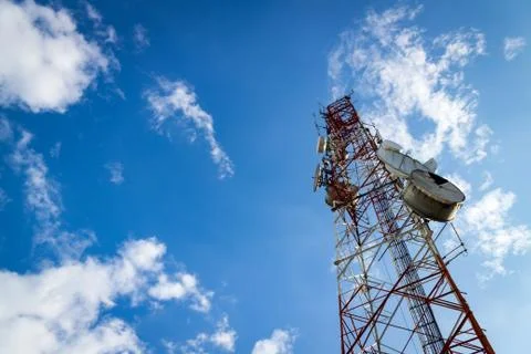 Communications Tower with cloud and blue sky Stock Photos
