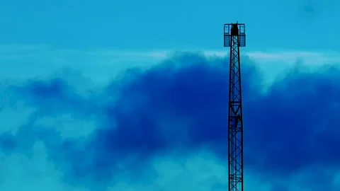 Communications tower timelapse with large blue sky copy space Video stock 332049415