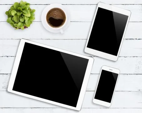 Communicator device phone and tablet white color tone on wood table, mockup m Stock Photos