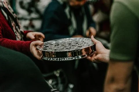 Communion with bread and wine during the service in the assembly Stock Photos