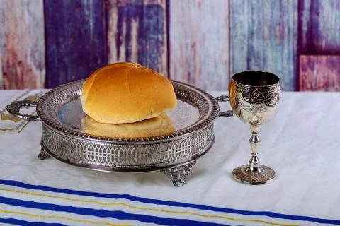 Communion elements represented by bread and wine over a red background Fotos Stock