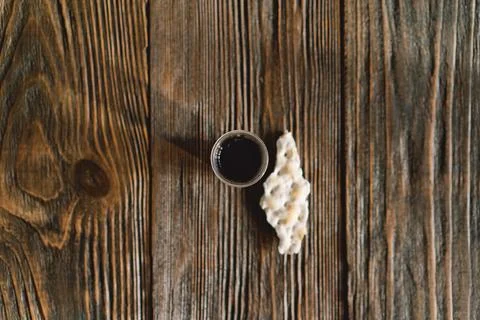 Communion. Religious tradition of breaking bread. Bread and wine Stock Photos