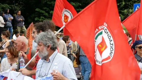 Communist party flags wave during demonstration in Milan, Italy Stock Footage 76080572