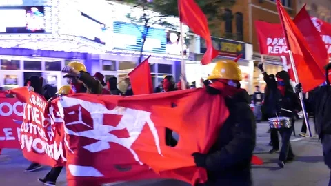 Communist protest at night downtown Stock Footage 99875405