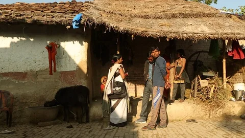 Community outreach health care worker (ASHA) talking with neighbors in India Stock Footage