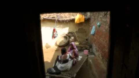 Community outreach health care worker (ASHA) making house call in India Stock Footage