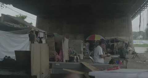 A community under the bridge in Cagayan de Oro, City, Mindanao, Philippines Stock Footage 230031615