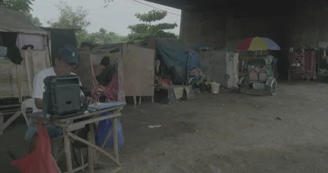 A community under the bridge in Cagayan de Oro, City, Mindanao, Philippines Stock Footage 230031860