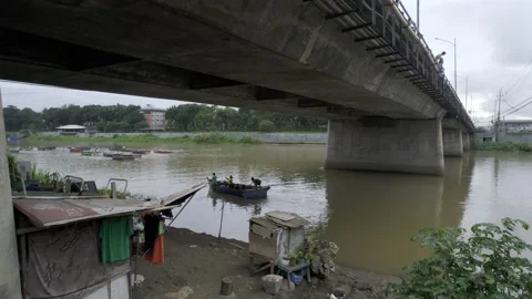 A community under the bridge in Cagayan de Oro, City, Mindanao, Philippines Stock Footage 230033191
