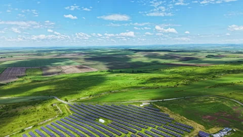 Communityoriented solar array set amid lush countryside lands. Ecologically Video stock 337947421