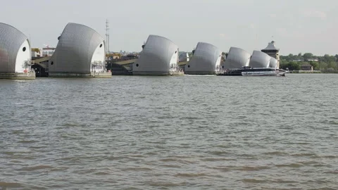 Commuter boat going through Thames Barrier flood gates, London, UK Stock Footage 284169831