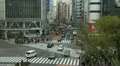 Commuter Commute Tokyo Business District Crowded Street Car Passing Bus Crossing HD Footage