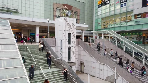 Commuter Crowd Walking at Shinjuku train station in Tokyo , Japan . Stock Footage 272867971