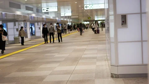 Commuter crowd walking in station Stock Footage 229249597