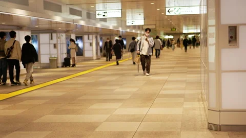 Commuter crowd walking in station Stock Footage 229249803