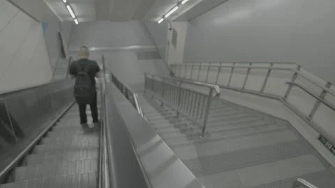 Commuter Descends a Long Escalator in Beijing Subway 스톡 동영상 341456450