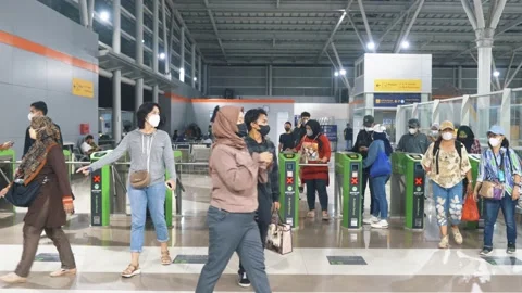 Commuter Line or MRT passengers are tapping the card at Bekasi Station Stock Footage 221394587