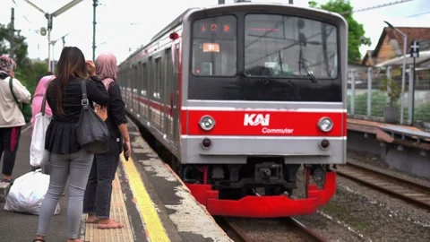 Commuter Line passengers wait for the train Stock Footage 300543230