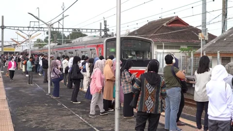 Commuter Line passengers wait for the train Stock Footage 300549403