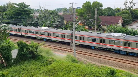 Commuter line train passes by. high angle shot Stock Footage 291695112