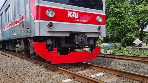 Commuter Line train passing through Video stock 337402974