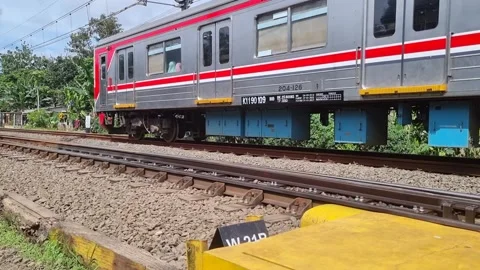 Commuter Line train passing through Video stock 337402976
