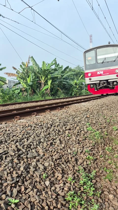 Commuter Line train passing through Video stock 338282686