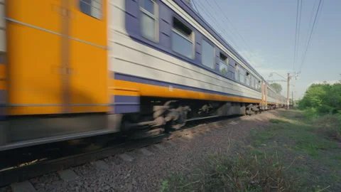 Commuter Passenger Train Passing By Camera at High Speed Close Up Slow Motion Stock Footage 335227459