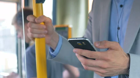 Commuter with phone in the bus Stock Footage 67106355