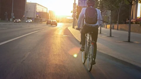 Commuter riding a bike on his morning travel to job Stock Footage