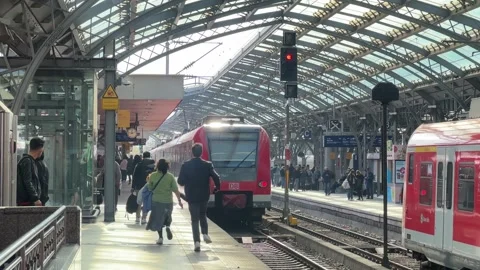 Commuter Running to Catch Train on Busy Railway Platform Stock Footage 328386778