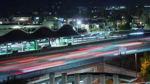 Commuter Rush Captured in Time-Lapse at Dublin BART and I-580 During Evening. Stock Footage 319007309