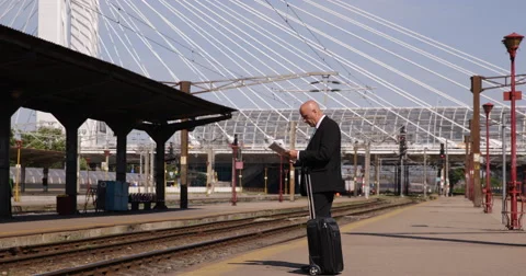 Commuter Standing Train Station Read News Paper Check Wristwatch Wait Platform Stock Footage 51860817
