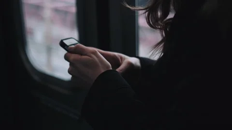 Commuter on subway train in New York looking at smart phone Stock Footage 59595119