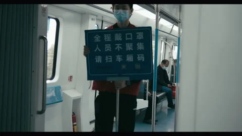 Commuter train after COVID lockdown, public health notice, Wuhan, China Stock Footage 132599238