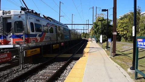 Commuter Train Arrives at Station Stock Footage 118925136