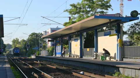 Commuter train arriving to the station Gresillons near Paris, France 스톡 동영상 117857811