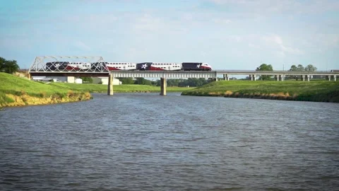 Commuter Train Crosses Trinity River (Medium Shot) Stock Footage 191105232