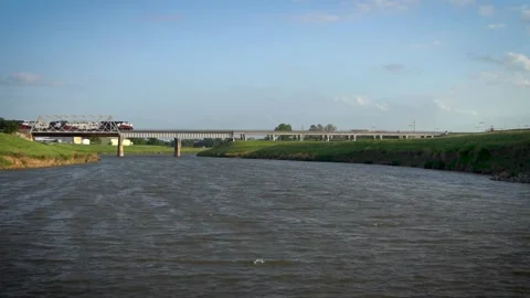 Commuter Train Crosses Trinity River (Wide Shot) Stock Footage 191105236
