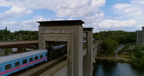 Commuter train crossing bridge at high speed Video stock 124007973