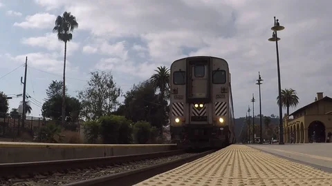 Commuter train leaving station Stock Footage 119335687