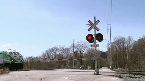 Commuter Train At Level Crossing Stock Footage 22697688